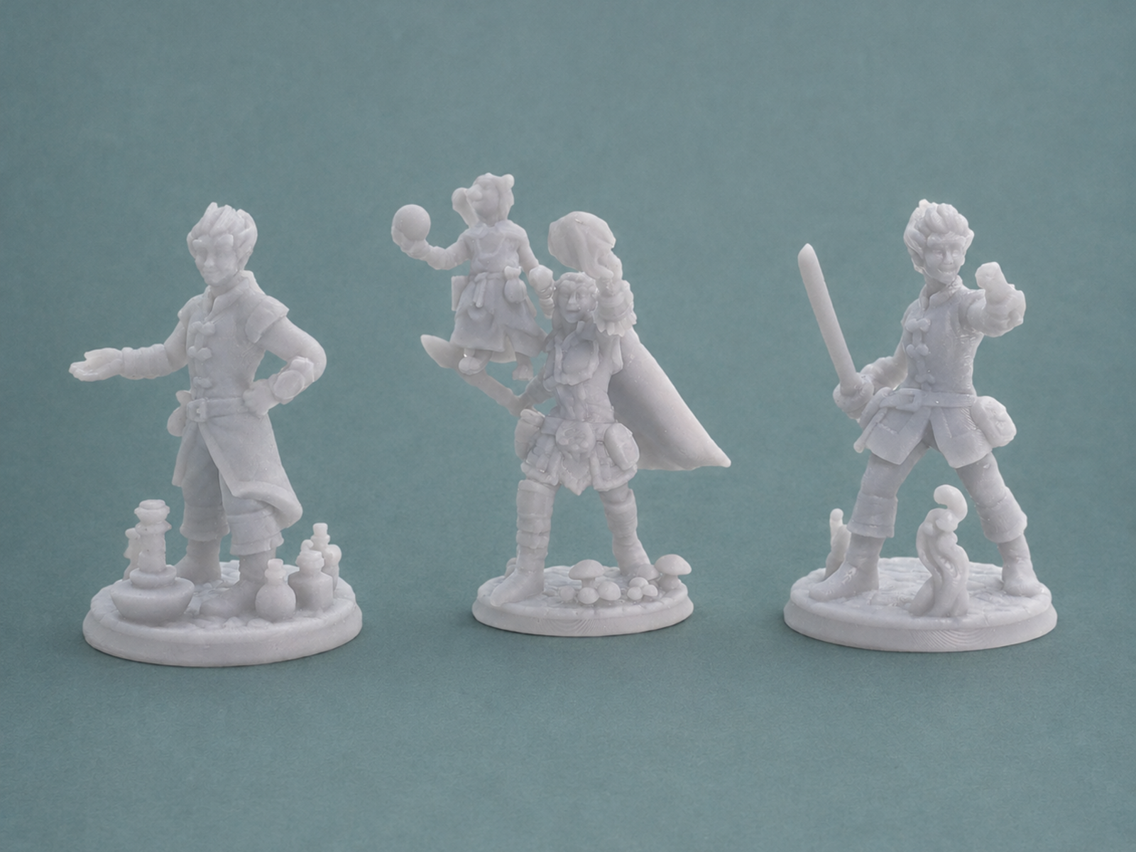 Three custom resin-printed tabletop miniatures